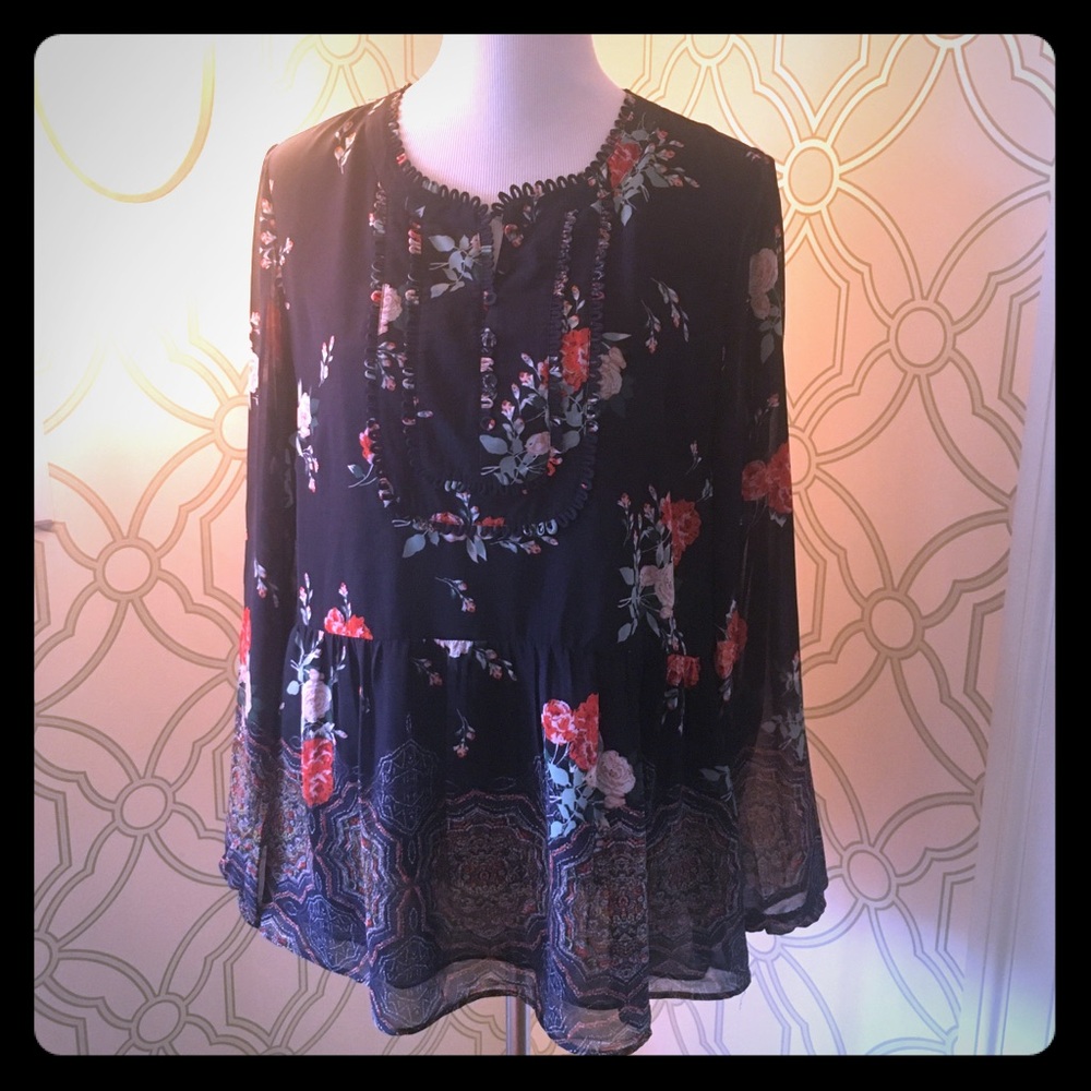 Peplum top in navy floral